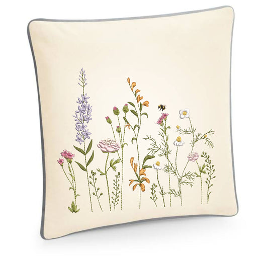 Embroidered cushion cover with garden wildflowers